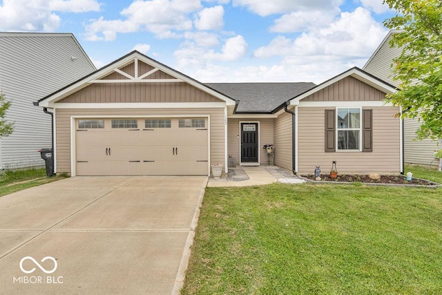 123 Campus Ln, Greenwood, IN 46143 - view of front of home featuring a garage, a front lawn, concrete driveway, and a shingled roof