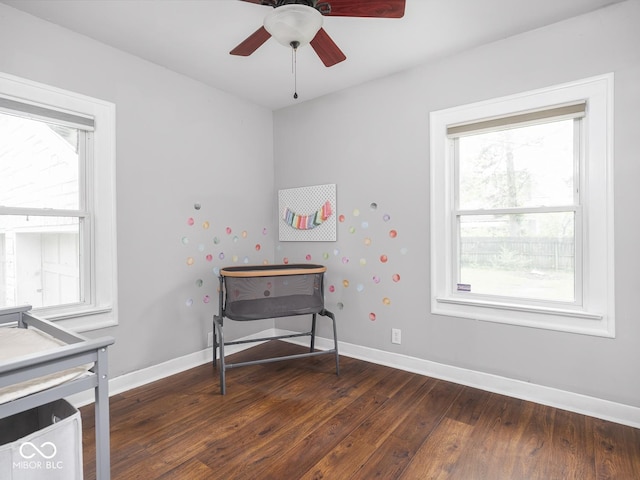 1617 E 52nd St, Indianapolis, IN 46205 - game room with healthy amount of natural light, dark wood-type flooring, ceiling fan, and baseboards