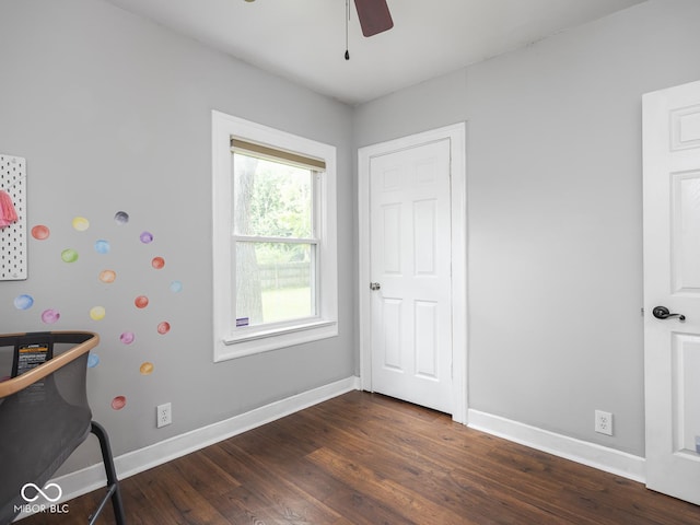 1617 E 52nd St, Indianapolis, IN 46205 - bedroom with dark wood-type flooring, baseboards, and a ceiling fan