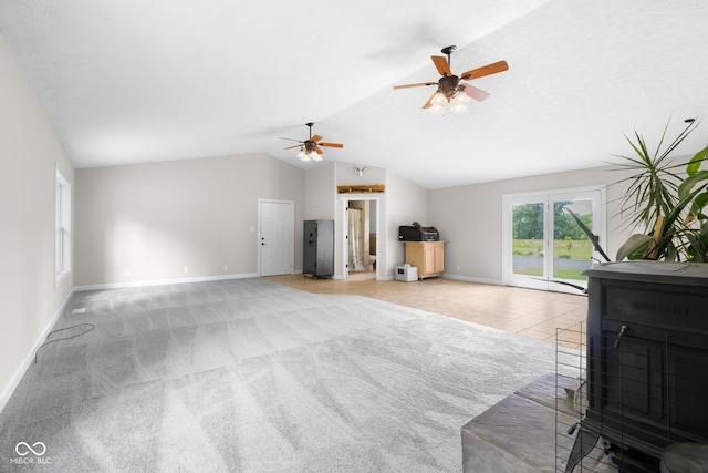 12383 S 25 W, Columbus, IN 47201 - living area with baseboards, vaulted ceiling, ceiling fan, and light colored carpet