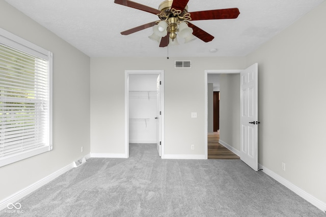 12383 S 25 W, Columbus, IN 47201 - unfurnished bedroom with carpet floors, a spacious closet, and baseboards