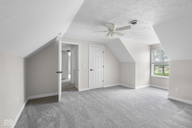 12383 S 25 W, Columbus, IN 47201 - bonus room with carpet floors, a ceiling fan, lofted ceiling, baseboards, and a textured ceiling