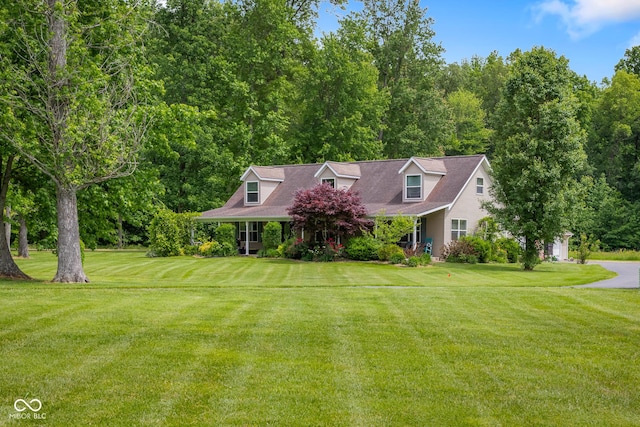 12383 S 25 W, Columbus, IN 47201 - cape cod-style house featuring a front yard and a porch