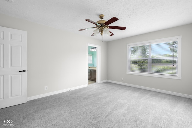12383 S 25 W, Columbus, IN 47201 - empty room featuring ceiling fan, light carpet, a textured ceiling, and baseboards