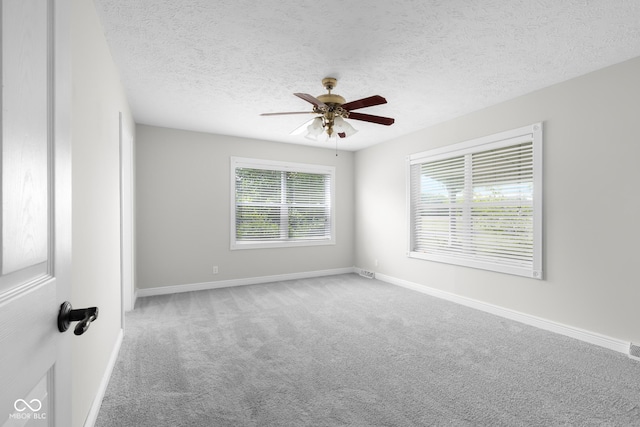12383 S 25 W, Columbus, IN 47201 - empty room featuring carpet flooring, a ceiling fan, baseboards, and a textured ceiling