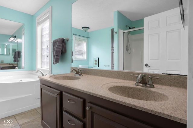 12383 S 25 W, Columbus, IN 47201 - bathroom with a stall shower, a bath, double vanity, and tile patterned floors