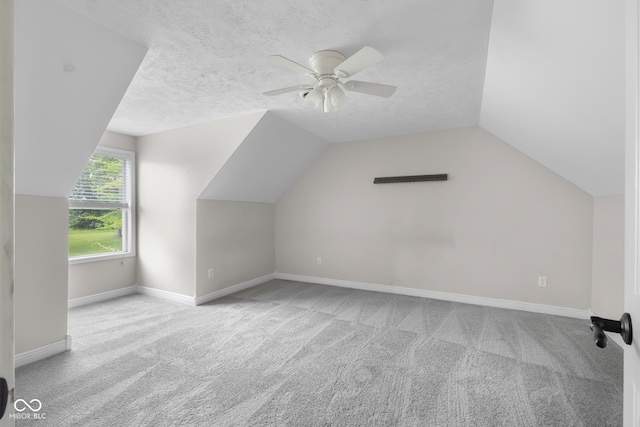 12383 S 25 W, Columbus, IN 47201 - additional living space featuring carpet, ceiling fan, lofted ceiling, baseboards, and a textured ceiling