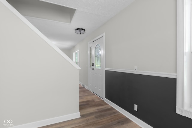12383 S 25 W, Columbus, IN 47201 - entrance foyer with dark wood-style floors, baseboards, and a textured ceiling