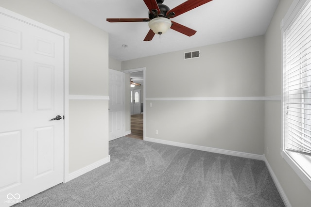 12383 S 25 W, Columbus, IN 47201 - unfurnished bedroom with carpet flooring, multiple windows, and baseboards