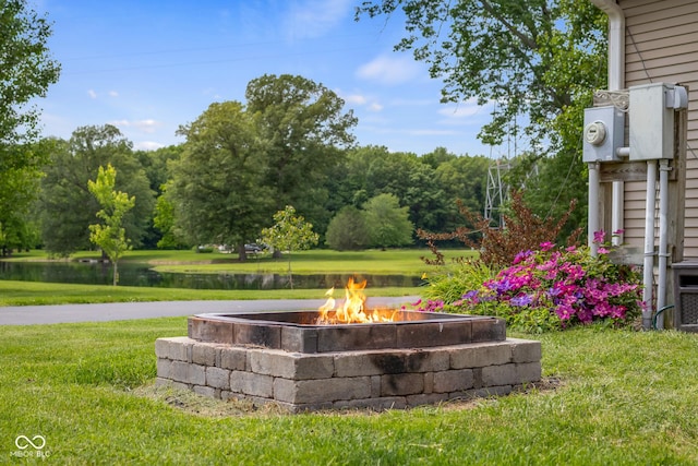 12383 S 25 W, Columbus, IN 47201 - view of grassy yard featuring a fire pit and a water view