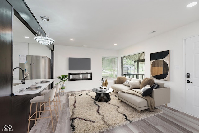 233 N Devon Ave, Indianapolis, IN 46219 - living area with wood finished floors, recessed lighting, and baseboards