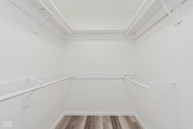 233 N Devon Ave, Indianapolis, IN 46219 - walk in closet featuring wood finished floors