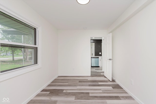233 N Devon Ave, Indianapolis, IN 46219 - empty room with light wood finished floors and baseboards