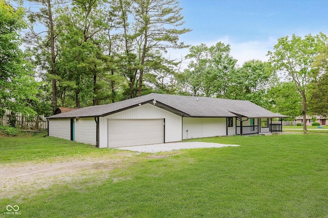 233 N Devon Ave, Indianapolis, IN 46219 - view of front of property featuring a sunroom, a front yard, a shingled roof, and view of wooded area