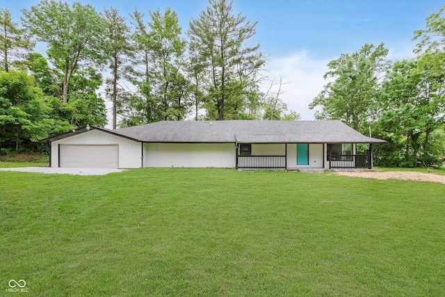 233 N Devon Ave, Indianapolis, IN 46219 - view of front of property with driveway, a front yard, a garage, and roof with shingles