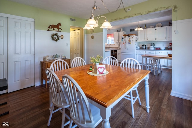 1052 Barley Cir, Carmel, IN 46032 - dining room featuring wine cooler and dark wood-style floors