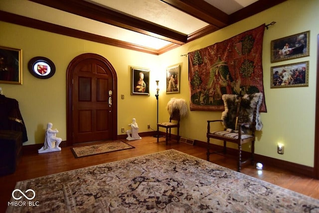 6412 Fall Creek Rd, Indianapolis, IN 46220 - entryway with arched walkways, wood finished floors, beam ceiling, and baseboards