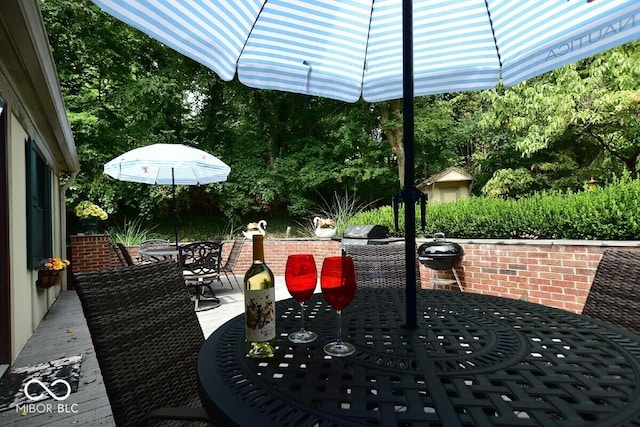 6412 Fall Creek Rd, Indianapolis, IN 46220 - view of patio / terrace with outdoor dining space, grilling area, and view of scattered trees