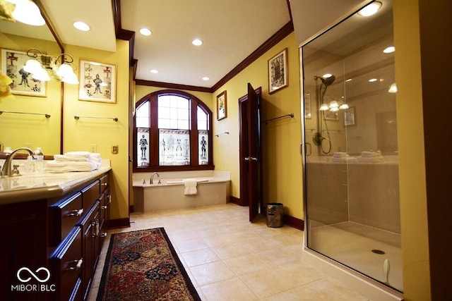 6412 Fall Creek Rd, Indianapolis, IN 46220 - bathroom with crown molding, a stall shower, a garden tub, vanity, and baseboards