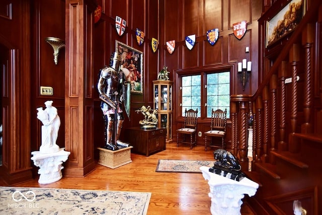 6412 Fall Creek Rd, Indianapolis, IN 46220 - entrance foyer with light wood finished floors, stairway, and a decorative wall