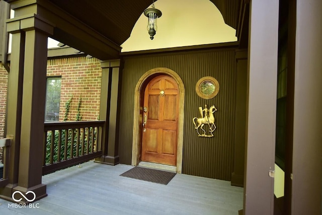 6412 Fall Creek Rd, Indianapolis, IN 46220 - view of exterior entry with a porch and brick siding