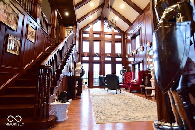 6412 Fall Creek Rd, Indianapolis, IN 46220 - foyer featuring beam ceiling, high vaulted ceiling, stairs, wood finished floors, and french doors