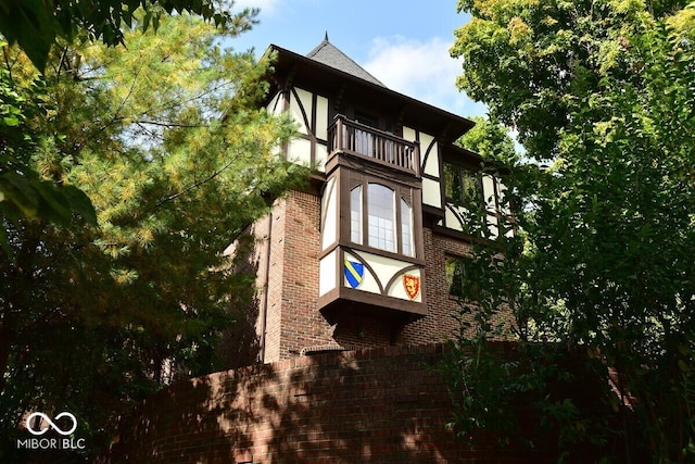 6412 Fall Creek Rd, Indianapolis, IN 46220 - view of side of property featuring a balcony and brick siding