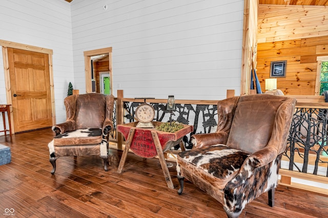 2780 W Grizzly Trl, Martinsville, IN 46151 - sitting room with wooden walls, a towering ceiling, and hardwood / wood-style floors