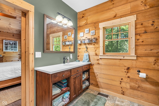 2780 W Grizzly Trl, Martinsville, IN 46151 - ensuite bathroom featuring wooden walls, vanity, and plenty of natural light