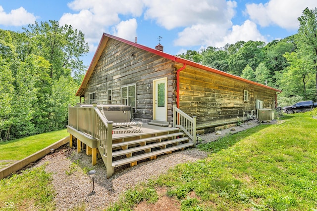 2780 W Grizzly Trl, Martinsville, IN 46151 - back of property featuring a deck, a lawn, central air condition unit, and a chimney
