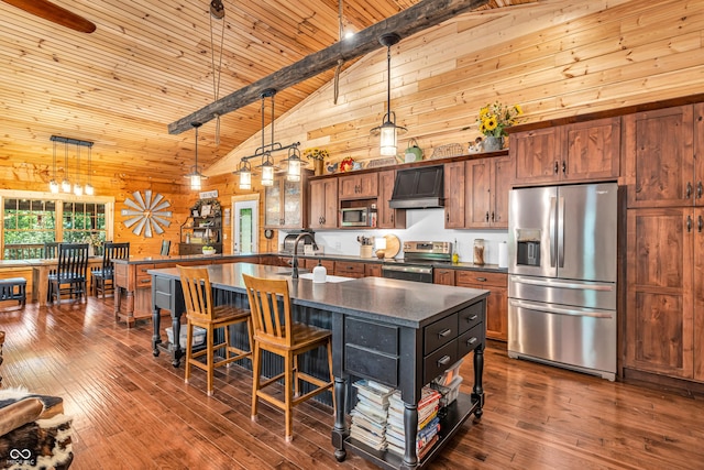 2780 W Grizzly Trl, Martinsville, IN 46151 - kitchen with stainless steel appliances, custom range hood, dark countertops, wooden walls, and a sink