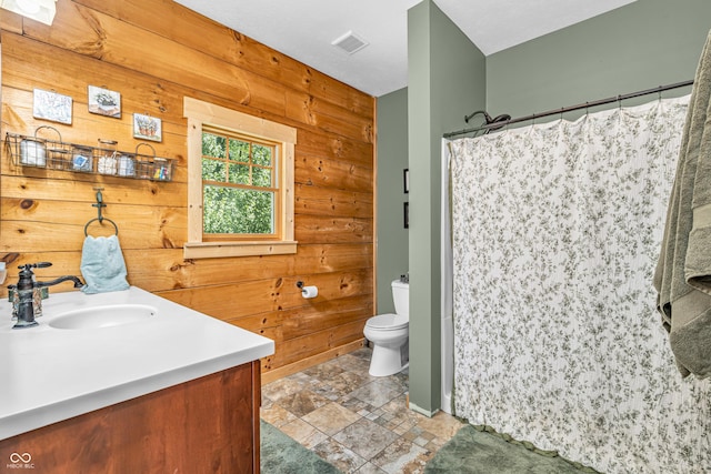 2780 W Grizzly Trl, Martinsville, IN 46151 - full bath featuring stone finish floors, vanity, wood walls, toilet, and a shower with shower curtain