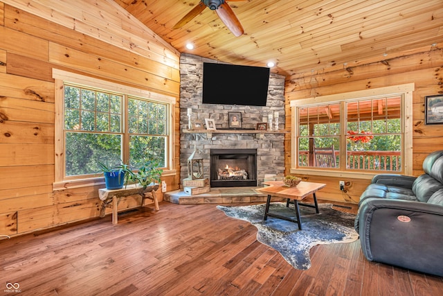 2780 W Grizzly Trl, Martinsville, IN 46151 - living area featuring wooden ceiling, a ceiling fan, healthy amount of natural light, vaulted ceiling, and a stone fireplace