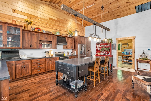 2780 W Grizzly Trl, Martinsville, IN 46151 - kitchen featuring appliances with stainless steel finishes, custom exhaust hood, wooden walls, dark countertops, and high vaulted ceiling