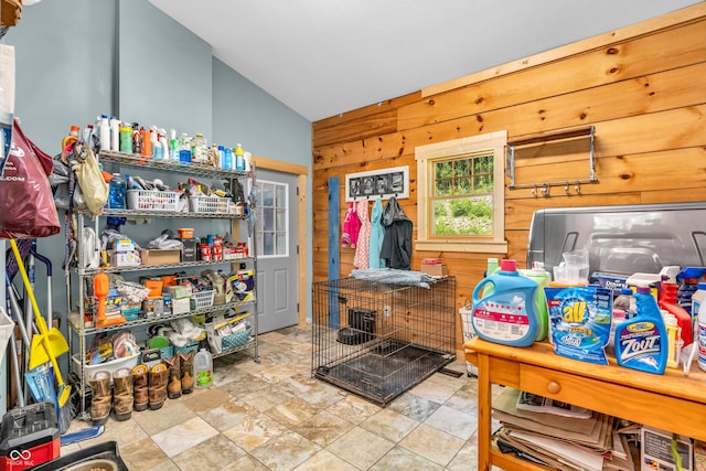 2780 W Grizzly Trl, Martinsville, IN 46151 - kitchen featuring wood walls, lofted ceiling, and stone finish flooring