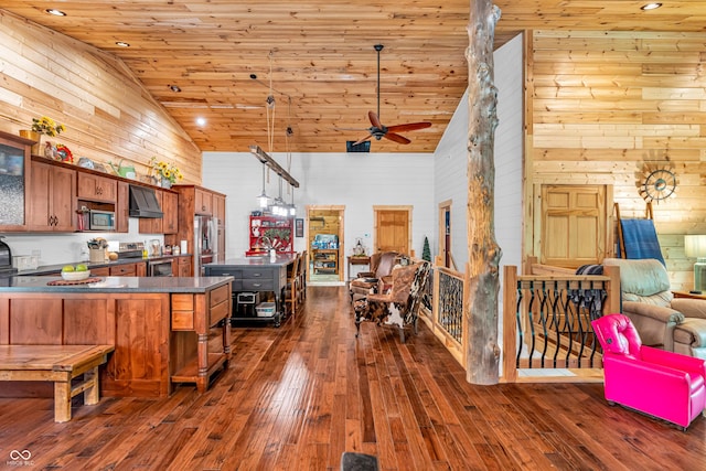 2780 W Grizzly Trl, Martinsville, IN 46151 - kitchen with high vaulted ceiling, stainless steel appliances, premium range hood, wooden walls, and dark countertops