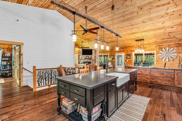 2780 W Grizzly Trl, Martinsville, IN 46151 - kitchen featuring high vaulted ceiling, a sink, wood walls, dark countertops, and a ceiling fan