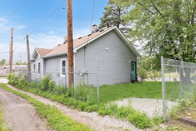2531 E Brookside Ave, Indianapolis, IN 46218 - view of property exterior with entry steps and a chimney