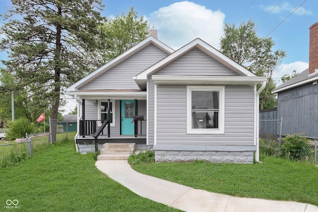 2531 E Brookside Ave, Indianapolis, IN 46218 - view of front of house featuring covered porch and a chimney