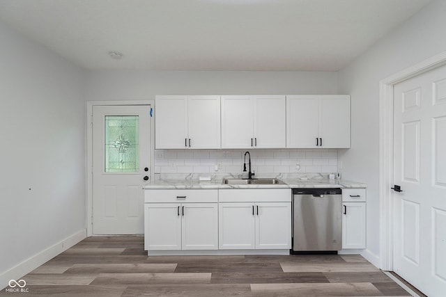 2531 E Brookside Ave, Indianapolis, IN 46218 - kitchen featuring dishwasher, a sink, wood finished floors, and white cabinetry