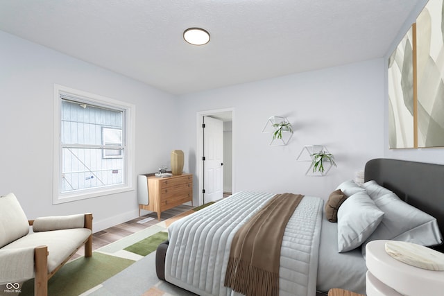 2531 E Brookside Ave, Indianapolis, IN 46218 - bedroom featuring wood finished floors and baseboards