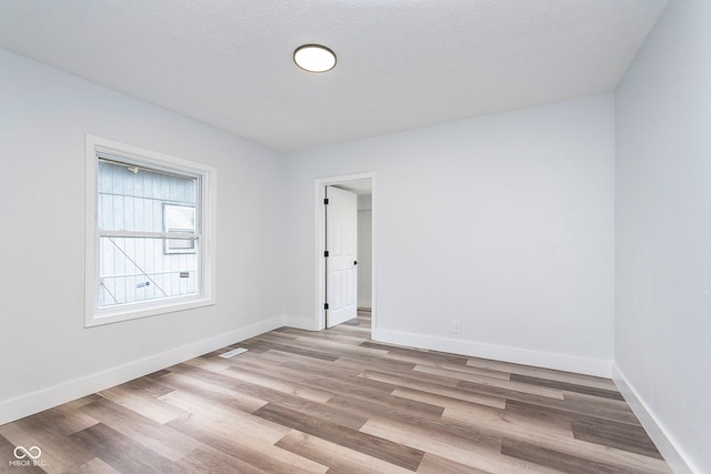 2531 E Brookside Ave, Indianapolis, IN 46218 - empty room with wood finished floors and baseboards