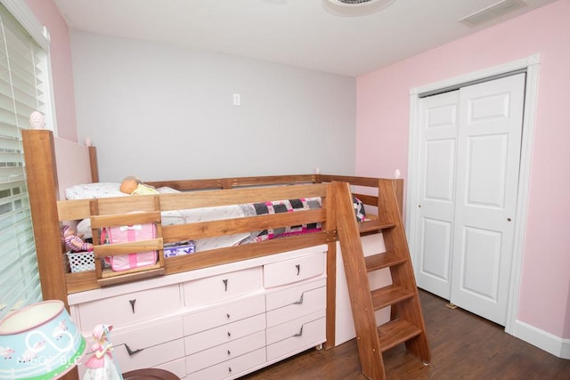 495 Persimmon Dr, North Vernon, IN 47265 - bedroom with dark wood-style flooring, a closet, and baseboards