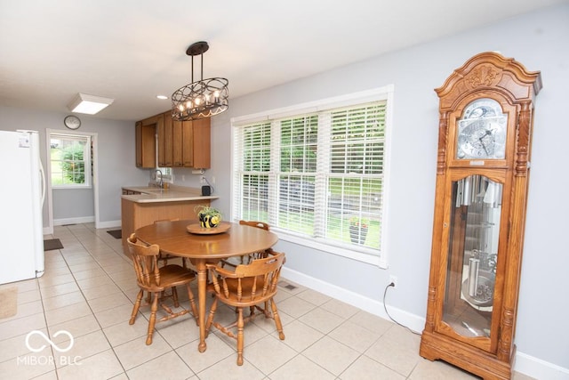 495 Persimmon Dr, North Vernon, IN 47265 - dining space featuring baseboards and light tile patterned floors