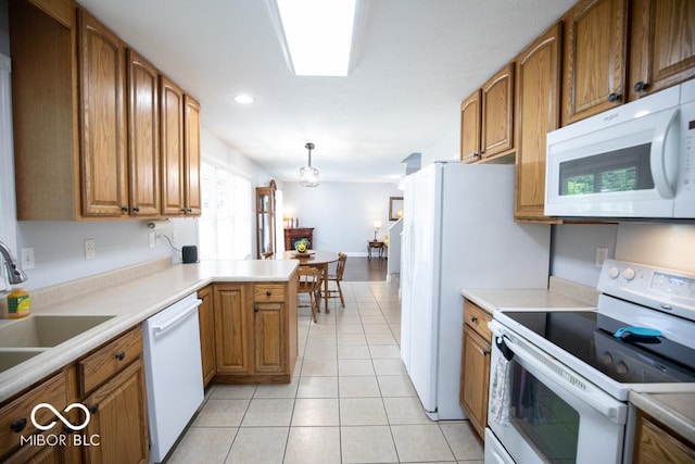 495 Persimmon Dr, North Vernon, IN 47265 - kitchen featuring white appliances, brown cabinetry, light tile patterned floors, a sink, and decorative light fixtures
