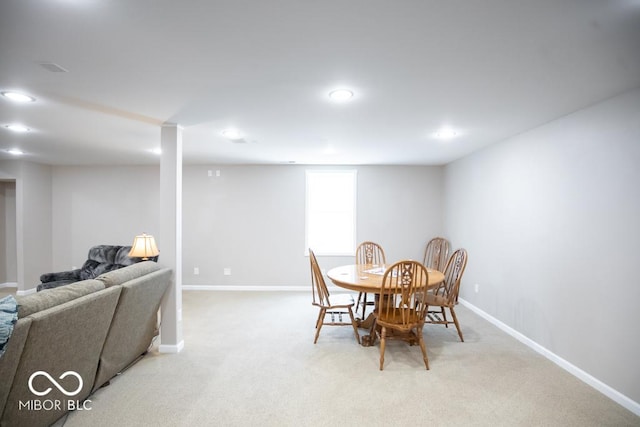 495 Persimmon Dr, North Vernon, IN 47265 - dining room featuring baseboards, light colored carpet, and recessed lighting