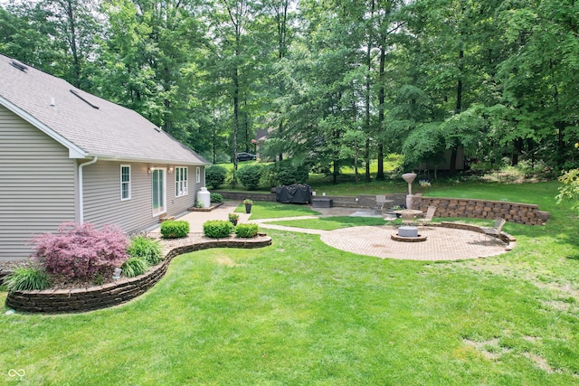495 Persimmon Dr, North Vernon, IN 47265 - view of grassy yard with a patio area