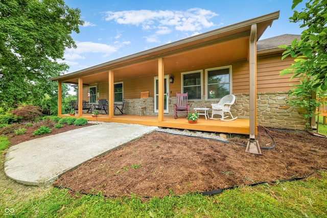 5730 S 50 W, Trafalgar, IN 46181 - back of property featuring stone siding and covered porch