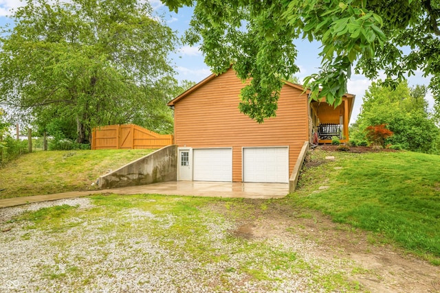 5730 S 50 W, Trafalgar, IN 46181 - view of side of home with driveway and a garage