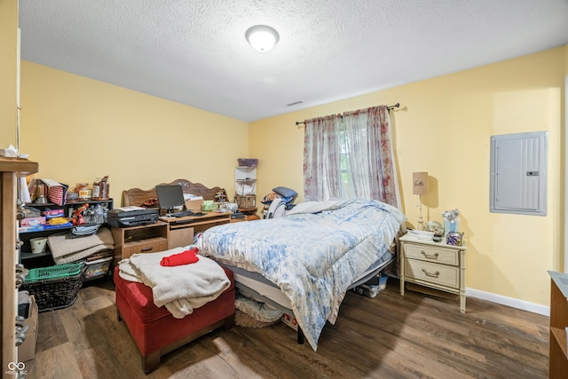 5730 S 50 W, Trafalgar, IN 46181 - bedroom with electric panel, wood finished floors, baseboards, and a textured ceiling